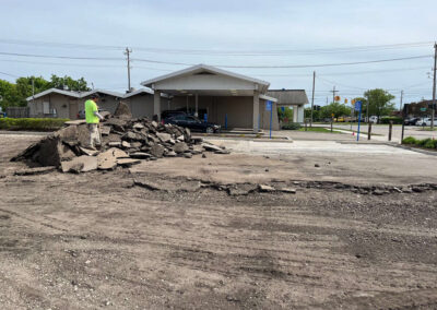 Chase Bank - Dearborn, Michigan 110 Worker standing on a pile of broken concrete in a dirt parking area